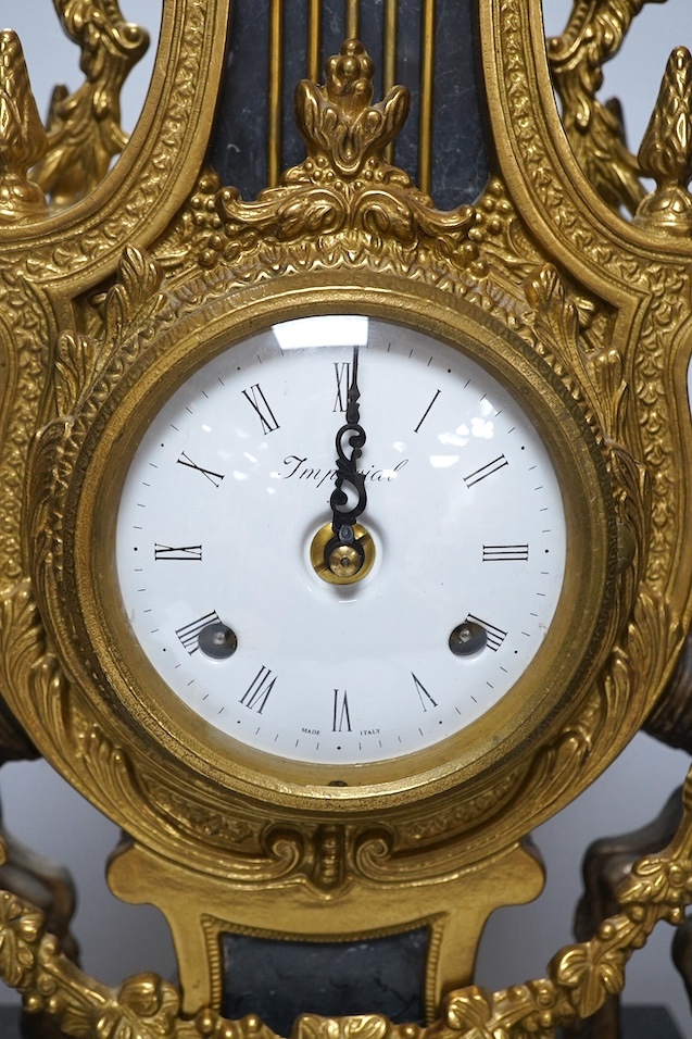 A bronze and marble three piece garniture, key, no pendulum, 69cm. Condition - good, not tested as working